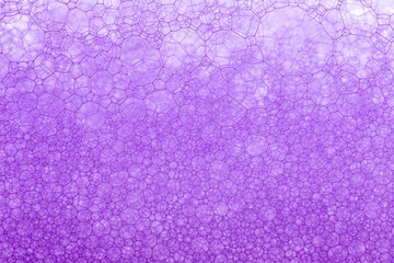 Bubbles on a red wine in the process of natural fermentation of the wort. alcoholic background