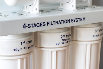 Four stages water filtration system for the home with granular activated and block carbon filters....
