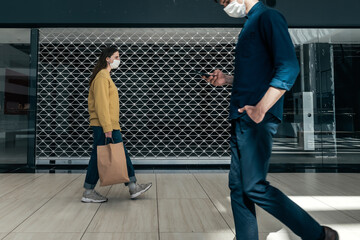 urban residents walking down the street during the pandemic