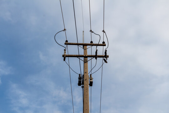 Electricity pole on blue sky and white cloud background