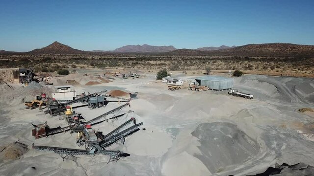 4K aerial drone video of African savanna hills, stone quarry near granite boulders range at B1 highway south of Windhoek in central highland Khomas Hochland of Namibia, southern Africa