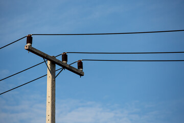 Electric Pole Power Lines And Wires With Blue Sky Background