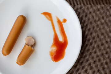 Sausage on a white plate in breakfast
