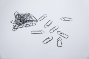 clip, refers to a metal object or galvanized and folded steel wire that serves to attach or group papers or other objects