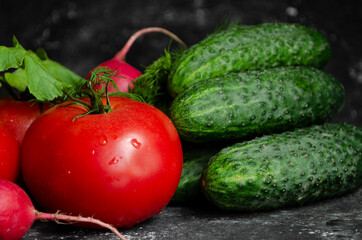 Fresh vegetables on the table. cucumbers, radishes, tomatoes