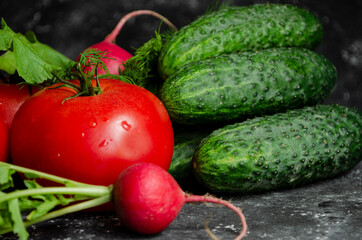 Fresh vegetables on the table. cucumbers, radishes, tomatoes