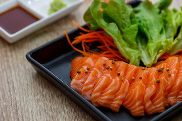 Raw salmon slice or salmon sashimi in Japanese style