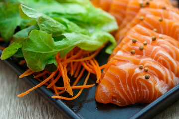 Raw salmon slice or salmon sashimi in Japanese style