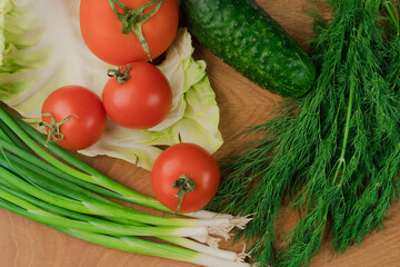 Still life, salad products on a wooden board