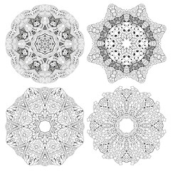 Hand drawn zentangle set of 4 mandalas for coloring page.
