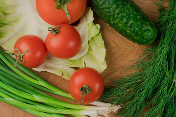 Still life, salad products on a wooden board