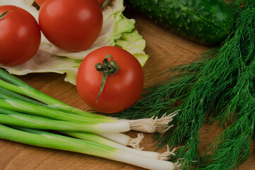 Still life, salad products on a wooden board
