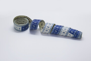 The plastic measuring tape is an instrument used to measure distances; can designate a flexible, graduated tape, normally used to measure fabrics or clothing
