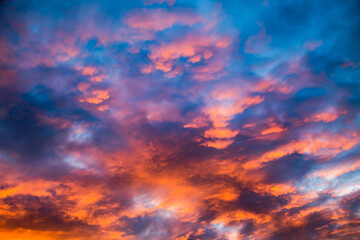 Fototapeta na wymiar Colorful image of dramatic cloudscape. Amazing clouds of pink, red, violet, gray color on the background of the evening dark sky after sunset.