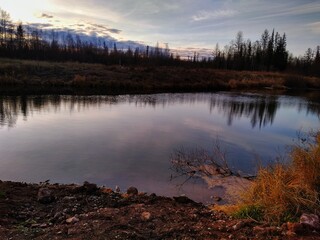 Autumn lake in the forest Siberia