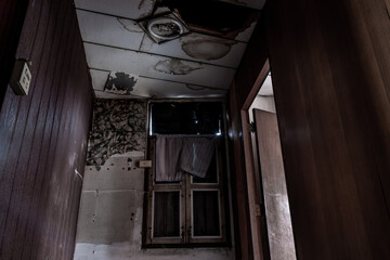 Bangkok, Thailand - Jan 19, 2020 : Abandoned room with window was left to deteriorate over time, Abandoned house, Destroyed house, Ruined house. Selective focus.
