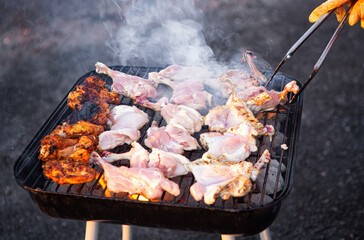 Chicken cooking on a charcoal grill