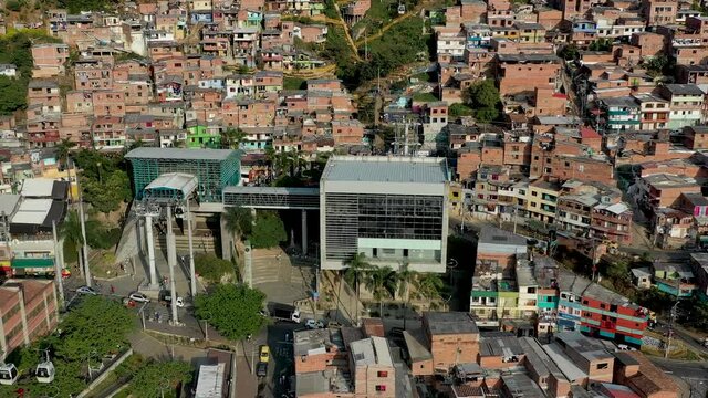 Famous Metrocable gondola lift system in Medellin. Aerial view of Medellin, the second-largest city in Colombia. Drone 4K