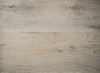 Fototapeta premium Light wooden surface. Beige gray board. Wooden laminate parquet floor texture background. Beautiful decorative background. Wood texture for background. Close-up wooden surface.
