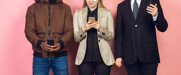 Group of friends using mobile smartphones. Teenagers addiction to new technology trends. Close up. Millenials texting, scrolling, chatting, watching video or shopping online. Connecting with devices.