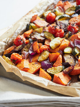 roasted vegetables pieces in a baking tray