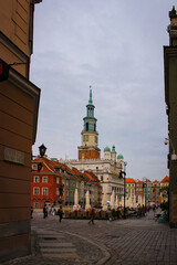 Fototapeta premium Poznan, Poland - May 05, 2015: People Walk In The Central Square Of The Old Town Near The Town Hall