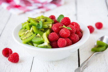 Fresh fruit salad with with raspberry and kiwi