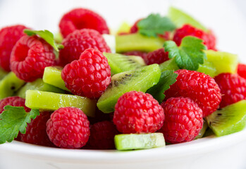 Fresh fruit salad with with raspberry and kiwi
