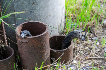 Severed underground electric power cable.