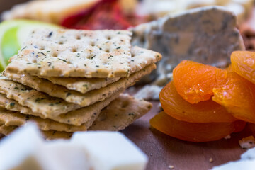 cheese, fruits, and bread on wood