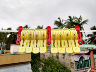 Colorful cloth hanging clips hang on a rope  