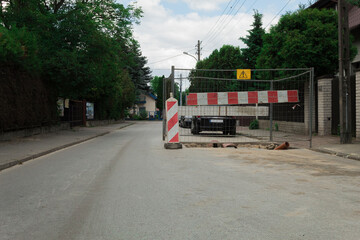 Naklejka premium Trench on the road and fenced