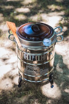 High angle shot of a Spanish kitchen appliance "Putxera"  on the ground under sunlight