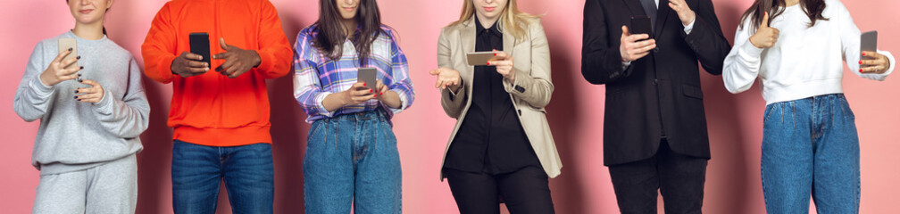 Group of friends using mobile smartphones. Teenagers addiction to new technology trends. Close up. Millenials scrolling, reading news, watching video or shopping online. Connecting with devices.