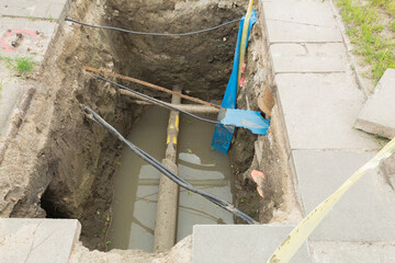 Trench with water and wires