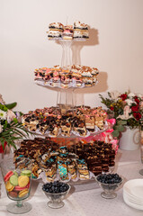 Sweet cakes at a wedding buffet. Catering