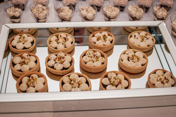 Sweet cakes at a wedding buffet. Catering