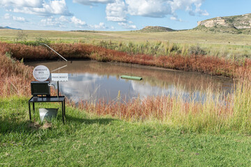 Fototapeta na wymiar Golf putting hole floating in a dam at Uithoek