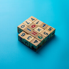 wooden cubes with numbers on a blue background