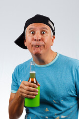 Funny looking man with bad teeth holding a beer