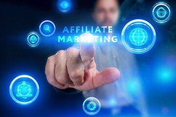 Business, Technology, Internet and network concept. Young businessman working on a virtual screen of the future and sees the inscription: Affiliate marketing