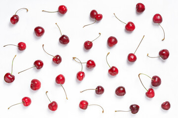 Obraz na płótnie Canvas Fresh cherries pattern on white background. Ripe cherry berries, top view.