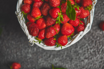 Strawberries in white basket. Fresh strawberries. Beautiful strawberries.