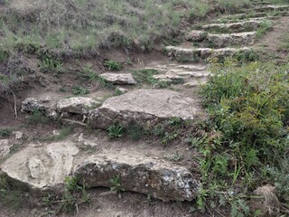 Gray steps from the cliff. Old gray stones.