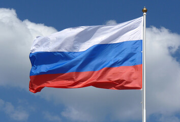 Russian flag on a background of cloudy sky