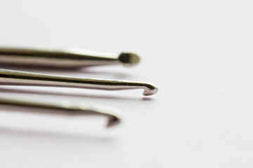 Fototapeta premium Set of crochet hooks close up. Metal tools for handmade