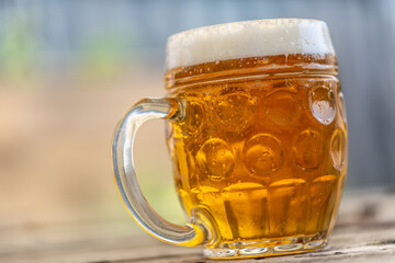 Pint of lager in a mug - close up