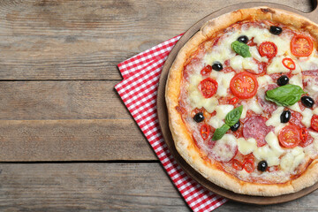 Delicious pizza Diablo on wooden table, top view. Space for text