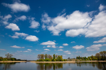 Beautiful river in the village on a sunny day with clouds. rest in the village