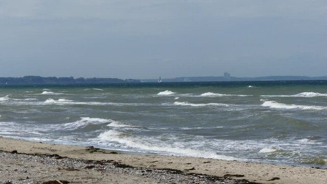Baltic Sea weather. Windy. Park. Stream. Sailboat.